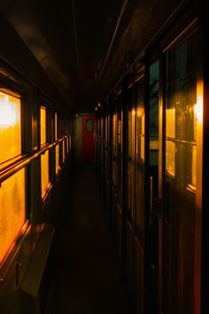 an empty train car with the sun shining down on it's windows and doors