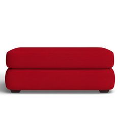 a red couch sitting on top of a white floor