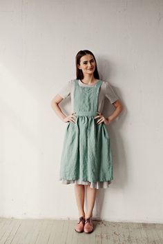 Midi cross back pinafore is made from 100% soft and washed linen. Details: - Colour: Mint - Composition: 100% Oeko-Tex certified linen - Cross back - Adjustable with buttons - Size: One size - Medium weight linen - Linen care: machine wash gentle; tumble dry low, ironing optional - The price is for one pinafore dress, other pictured items are not included Cheap Blue Pinafore Dress For Spring, Vida Apron Dress, Cheap Pinafore Dress For School In Spring, Cheap Casual Pinafore Dress For Spring, Cheap Casual Pinafore Dress With Pockets, Affordable Cotton Pinafore Dress With Pockets, Cheap School Pinafore Dress For Spring, Pinafore Dress Kitchen Utensils, Traditional Aprons