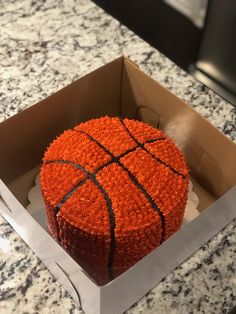 a basketball cake in a box on a table