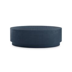 a large blue round object sitting on top of a white surface with no one around it