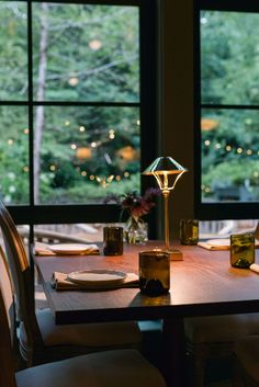 the table is set with plates and place settings for two people to sit at it