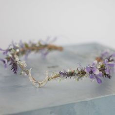 a purple flower crown on top of a table