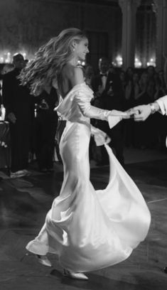 a man and woman are dancing on the dance floor in front of a large crowd