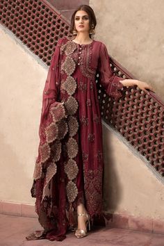 Chiffon Party Outfit in Maroon Color in Elegant Design emblazoned with thread embroidery in Pretty design. Chiffon dresses are available online at this store. You can wear these chiffon dresses on Party, Wedding and Eid events. Frock: Chiffon Party outfit frock in maroon color is embellished with copper thread hand embroidered front, back , side and neckline patch. Front and back daman is also designed with hand embroidered patch. Bottom and sleeves of the dress is embellished with embroidered h Pakistani Designer Dress, Estilo Hijab, Indian Party Wear, Pakistani Fancy Dresses, Pakistani Dresses Casual, Pakistani Fashion Party Wear, Outfits Dress, Salwar Kamiz, Pakistani Bridal Dresses