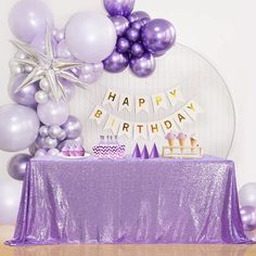 a birthday party with purple and silver decorations