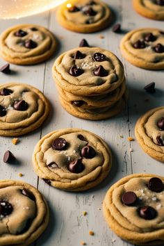 chocolate chip cookies are arranged on a table