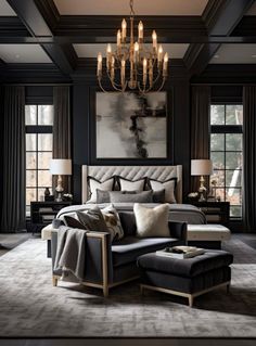 an elegant bedroom with black walls and chandelier