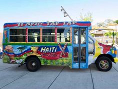 a brightly painted bus parked on the side of the road