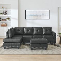 a living room with a sectional couch and ottoman