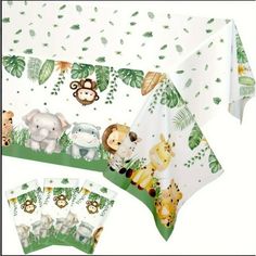 a table cloth with animals on it and jungle leaves in the background, along with matching napkins