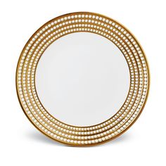 a gold plate with white dots on it