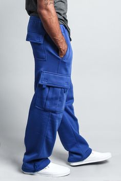 Enjoy all-day comfort in these super soft fleece cargo pants. Made of a heavyweight fleece, these will be your go-to pants, whether at home, at the gym, or out on the streets! 60% Cotton, 40% Polyester Machine wash cold inside-out with like colors Features drawstring elastic waist, elastic drawstring adjustable cuffs, velcro closure on cargo pocket Sizing note: Fit runs a bit small. Please size up for a more comfortable fit. * If the color you want is out of stock, try this similar style - VS77 Blue Cargo Pants Outfit, Cargo Pants Outfit Men, Overalls And Sweater, Blue Cargo Pants, Track Pants Mens, Pants Outfit Men, Guayabera Shirt, Cargo Pants Outfit, Stylish Mens Outfits