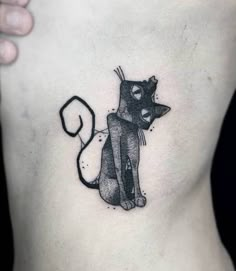 a black and white cat tattoo on the stomach