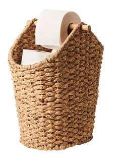 a woven basket with toilet paper in it