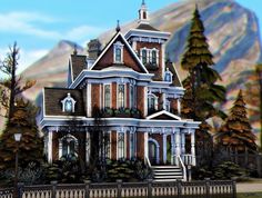 a large victorian style house in the mountains