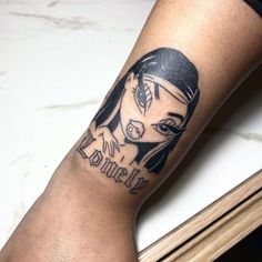 a woman's leg with a tattoo on it