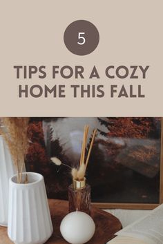 three vases and an open book on a table with the title 5 tips for a cozy home this fall