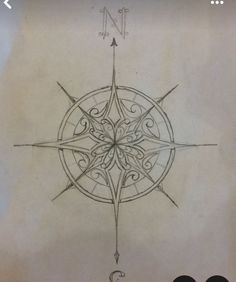 a drawing of a compass on paper with the number 3 in it's center