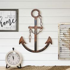 an anchor, clock and shutters are on the wall