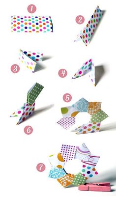 the instructions for how to make an origami bow with colored dots on it