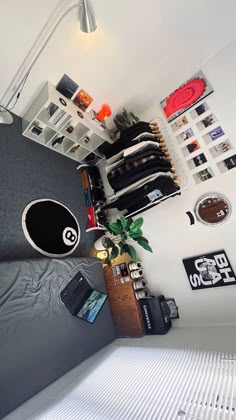 a bed room with a neatly made bed and lots of clutter on the wall