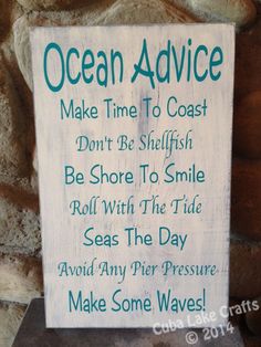 a sign that is on the side of a stone wall saying ocean advice make time to coast don't be selfish be shore to smile roll with the tide seas the day avoid any pier pressure