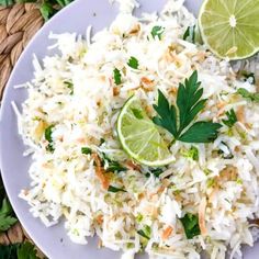 a white plate topped with rice and limes