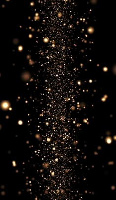 an image of some gold glitter on a black background