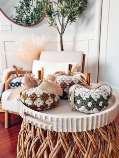 a wicker table topped with baskets filled with dried herbs and twine burlocks