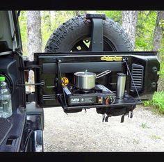 the back end of a truck with an open camper