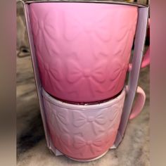 two pink cups stacked on top of each other