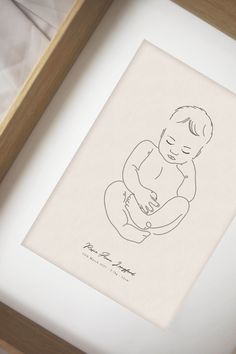 a drawing of a baby in a wooden frame