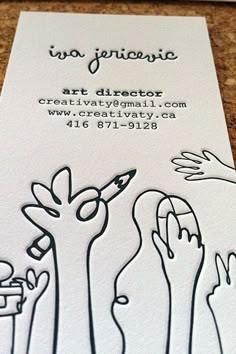 the business card is designed to look like hand drawn hands