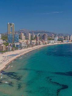 an aerial view of the beach and city skyline