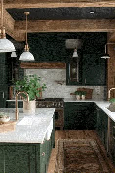 a kitchen with dark green cabinets and white counter tops, an area rug on the floor