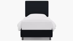 a black and white bed with two pillows on it's headboard, in front of a white background