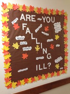 a bulletin board with fall leaves and words written on it that read are you falling ill?