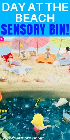 there is a fake beach with people on it and text overlay that reads, day at the beach sensory bin