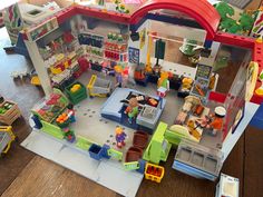 a toy house with lots of toys in it