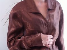 Vintage shiny brown shirt. 90's sheen brown bronze blouse. Fits like a M. Made in spain. Measurements lying flat: Bust: Waist: Length: Very good condition. Vintage Brown Party Top, Fitted Tops With Sheen For Fall, Fitted Fall Tops With Sheen, Formal Brown Spring Shirt, Formal Brown Shirt For Spring, Brown Long Sleeve Party Blouse, Brown Long Sleeve Blouse For Party, Brown Silk Party Tops, Party Brown Silk Tops