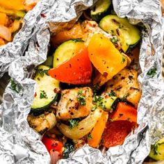 chicken, zucchini and tomatoes wrapped in foil