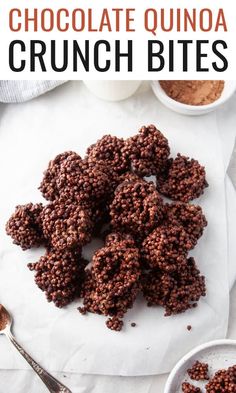 chocolate quinoa crunch bites on a white plate with spoons and bowls in the background