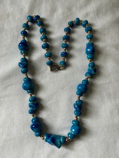 "Unique Egyptian Handmade Blue Ceramic c Necklace    With Gold plated beads   Size: Approximately 23\" Total (End to End).   For more items: Visit our store at https://www.ebay.com/str/scarabbazaaregyptiangifts" Vintage Blue Single Strand Necklace, Blue Costume Jewelry With Colorful Beads, Blue Polished Beads Costume Jewelry, Vintage Blue Single Strand Beaded Necklaces, Handmade Blue Oval Beads Jewelry, Handmade Blue Oval Bead Jewelry, Blue Oval Beads Necklaces For Jewelry Making, Blue Oval Bead Jewelry With Large Beads, Handmade Adjustable Blue Turquoise Necklace