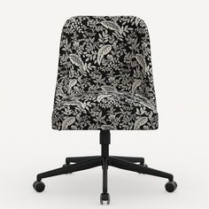 a black and white floral office chair with wheels on an isolated background, viewed from the front