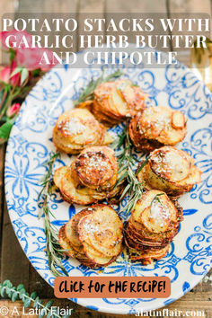 potato stacks with garlic herb butter and chipotle on a blue and white plate