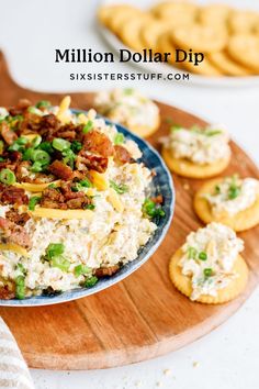 a plate full of food and crackers on a table with the words million dollar dip