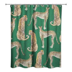 a shower curtain with cheetah and leopards printed on it, in front of a green background