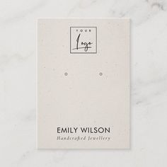 a white business card with an image of a square logo on the front and bottom