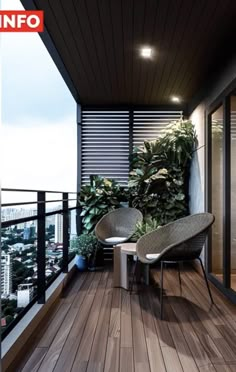 a balcony with two chairs and a table on the floor next to a planter